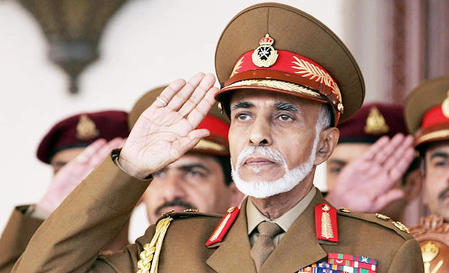 A file photo taken on November 18, 2013 shows Oman's Sultan Qaboos bin Said saluting during the military parade in the capital Muscat. (AFP)