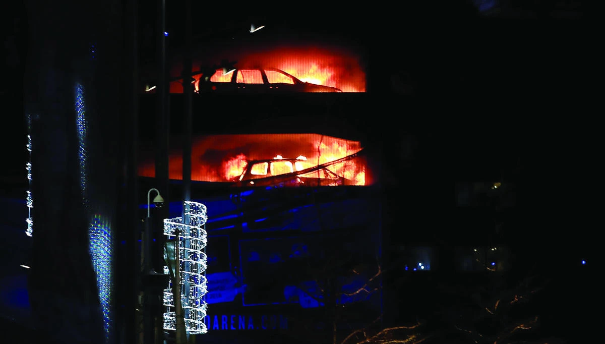 Cars are seen on fire during a serious blaze in a multi-storey car park in Liverpool on Sunday. (Reuters)