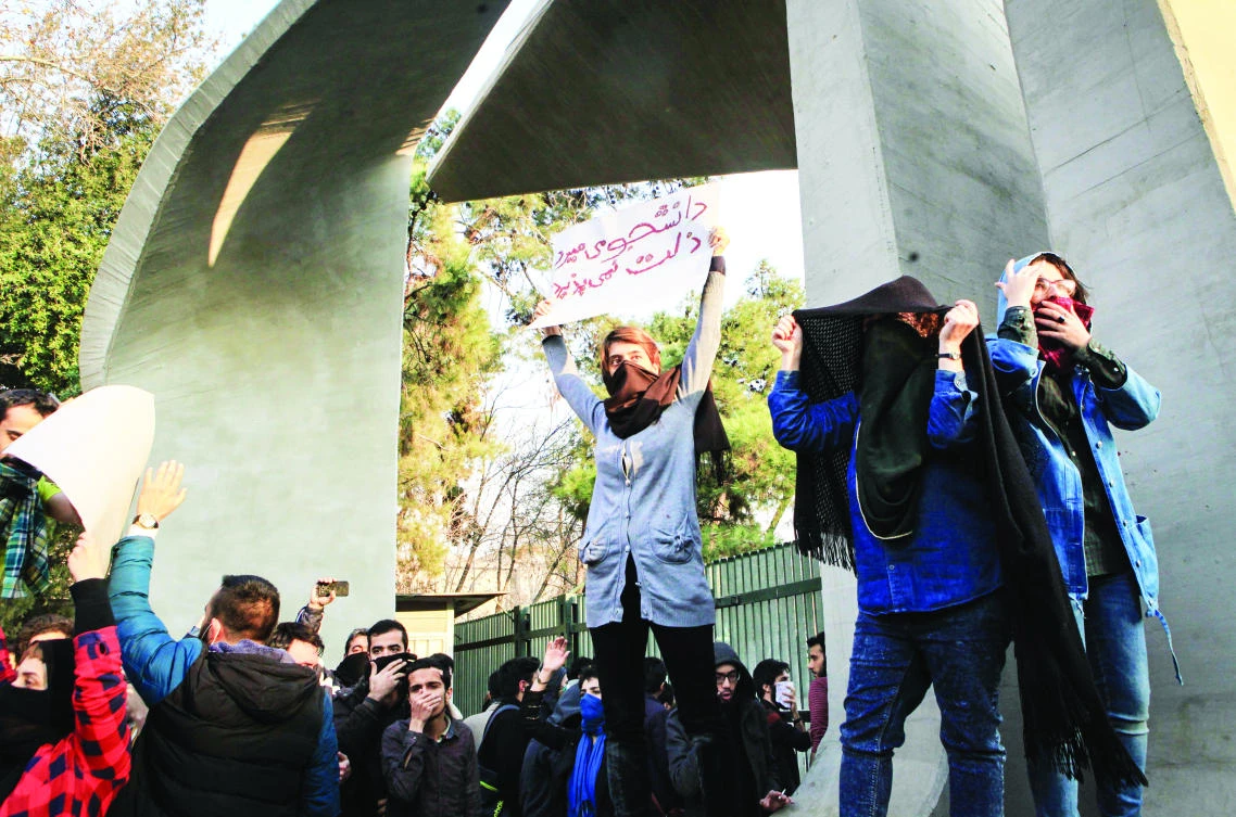 Iranian students stage a protest at the University of Tehran on Dec. 30. (AFP)
