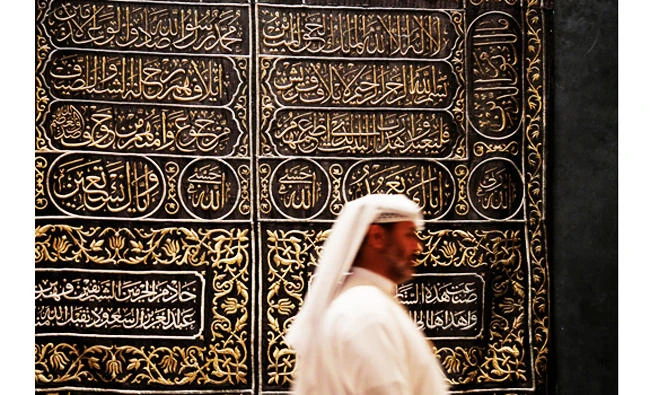 This photo taken on April 16, 2015, a Saudi man walks next to Kaaba door curtain at Riyadh National Museum in Riyadh, Saudi Arabia. (AP)