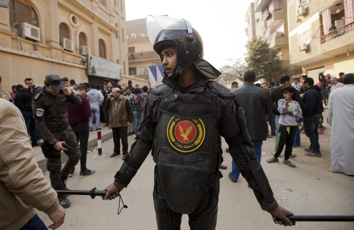 A policeman stands guard in front of Mar Mina church, in Helwan, Cairo, Egypt, Friday, Dec. 29, 2017, where several people have been killed in a shootout outside the church. (AP/Amr Nabil)
