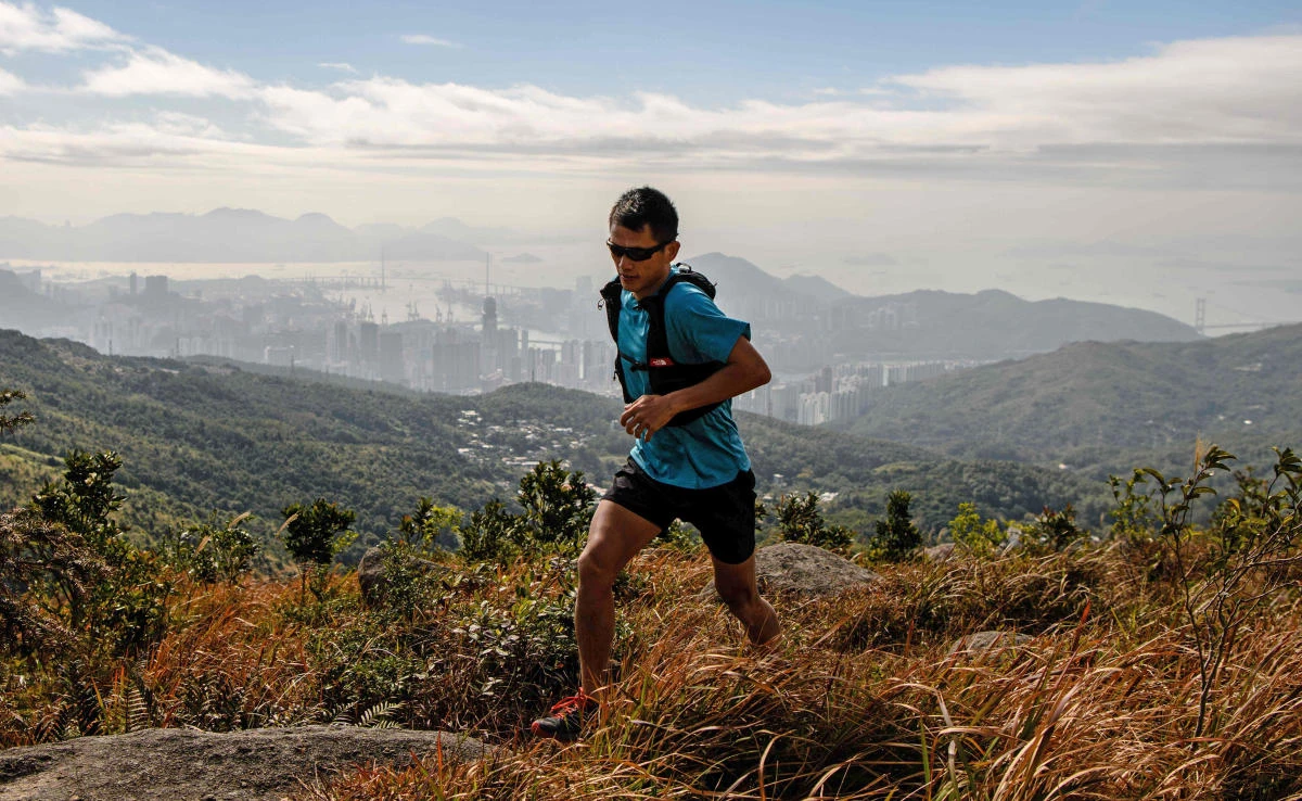 This file photo shows trail runner Stone Tsang, 39, running on Hong Kong’s highest peak Tai Mo Shan on Dec. 14, 2017. (AFP)