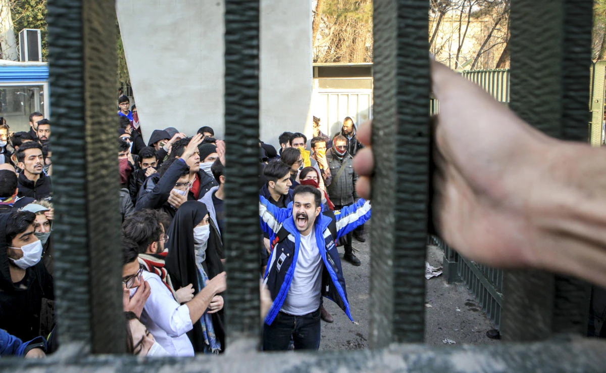 In this file photo, university students attend an anti-government protest inside Tehran University, in Tehran, Iran on Dec. 30, 2017. (AP)