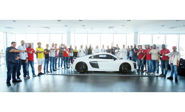 Members of Audi Sport owners' club pose with the latest Audi A8 in Jeddah.