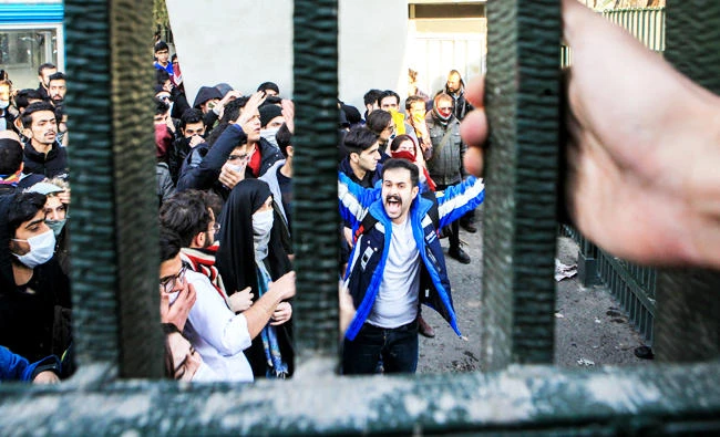In this Dec. 30, 2017 photo, by an individual not employed by the Associated Press and obtained by the AP outside Iran, university students attend an anti-government protest inside Tehran University, in Tehran, Iran. (AP)