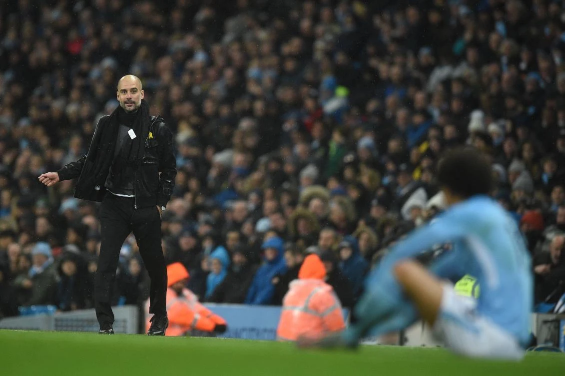 Manchester City’s Spanish manager Pep Guardiola (L) looks at Manchester City’s German midfielder Leroy Sane during the English Premier League football match between Manchester City and Watford at the Etihad Stadium in Manchester, north west England, on Jan. 2, 2018. (AFP/Oli Scarff)