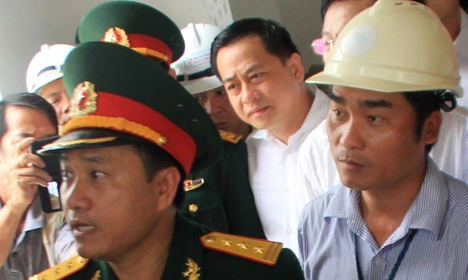 This picture taken on April 29, 2016 shows Phan Van Anh Vu, center, at a local event in the central coastal city of Da Nang. (AFP)