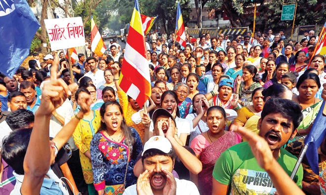 Members of the Dalit community shout slogans as they block a road during a protest in Mumbai on Wednesday. (Reuters)
