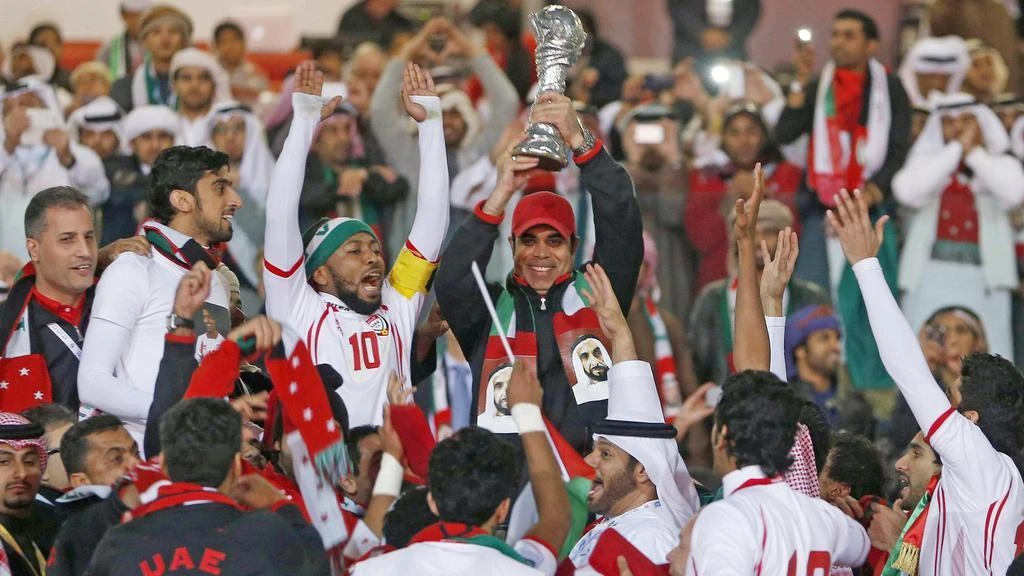 Mahdi Ali, UAE players and supporters celebrate the 2013 final win over Iraq. (Reuters)
