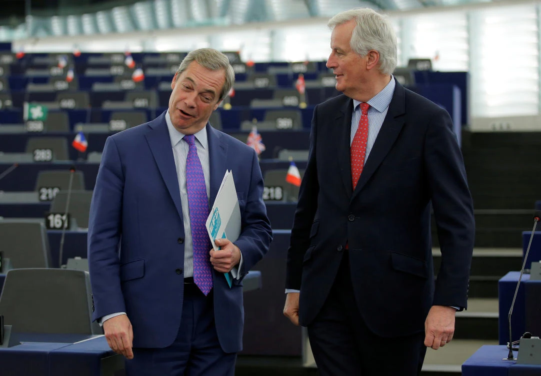 EU Brexit negotiator Michel Barnier (R) talks with Nigel Farage at the European Parliament in Strasbourg, April 5, 2017. (Reuters)