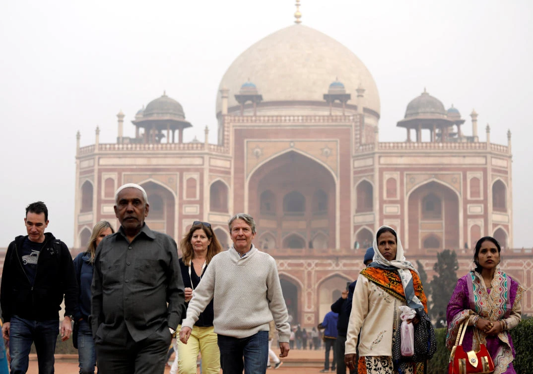 Domestic and foreign tourists walk in front of Humayun's Tomb, one of the tourist destinations in New Delhi. Over 9 million foreigners visited India in the first 11 months of 2017, up 15.6 percent from a year ago. (Reuters)