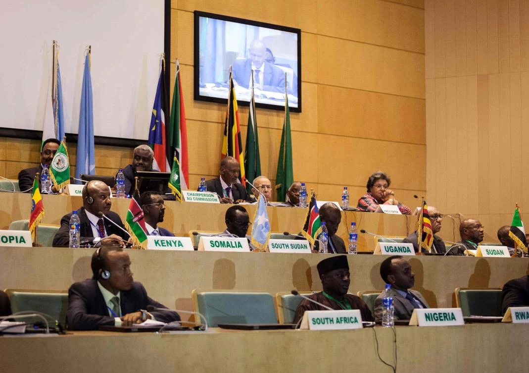 In this file photo taken on Dec. 21, 2017, African Union chairman Moussa Faki (2nd L-top) sits with members of the Intergovernmental Authority for Development (IGAD) as they attend a signing ceremony for the cease-fire agreement among South Sudanese parties in Addis Ababa. (AFP)