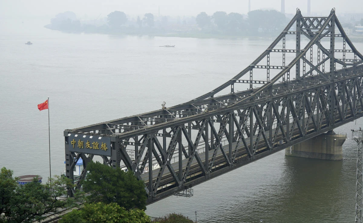 In this file photo, a Chinese flag flies over the Chinese end of the Friendship Bridge connecting China and North Korea in Dandong in northeastern China’s Liaoning province on Sept. 9, 2017. (AP)
