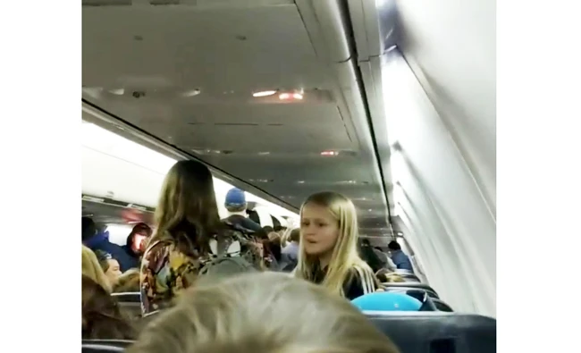 Passengers react in a plane that has collided with another plane at Toronto's Pearson Airport, Canada, on Friday in this still image taken from social media video. (Reuters)