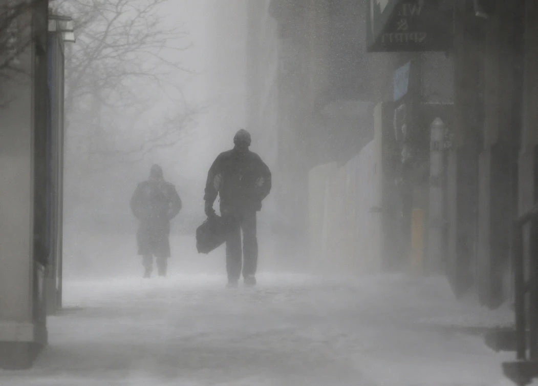 Pedestrians make their way through wind and snow in New York. The snowstorm that hit the East Coast with frigid, wind-whipped whiteness and ice that wouldn’t melt seems to pick a different bull’s eye target each day. (AP)