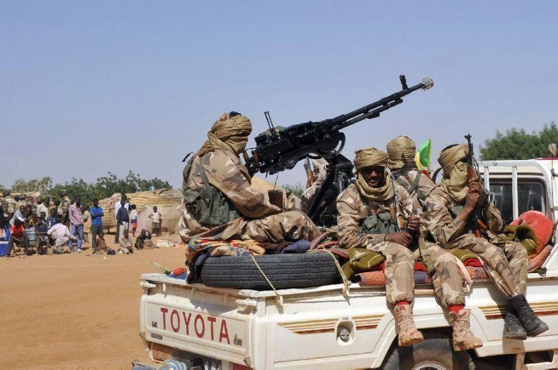 In this file photo, Malian Tuareg soldiers patrol the streets on February 3, 2013, in Gao. (AFP)