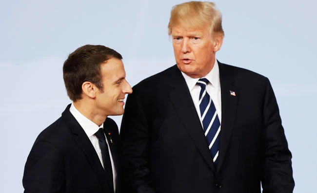 France's President Emmanuel Macron, left, and U.S. President Donald Trump chat after the family photo on the first day of the G-20 summit in Hamburg, northern Germany, in this July 7, 2017 photo. (AP)