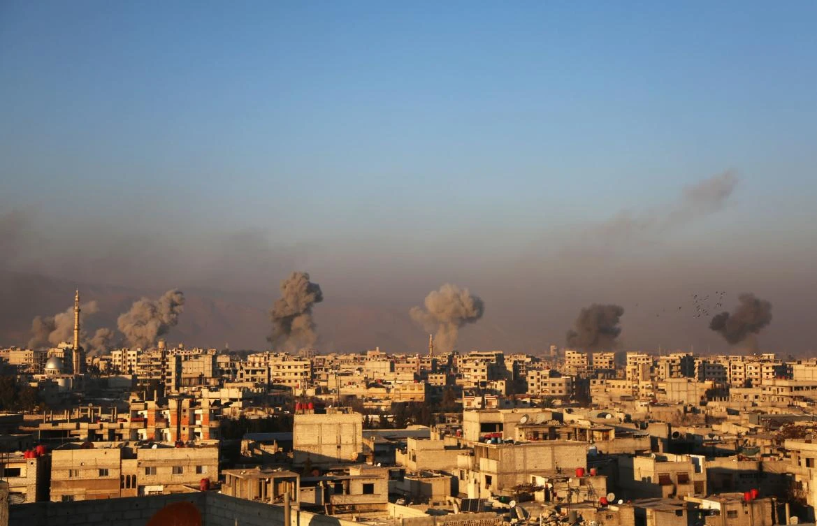 Smoke rises above Arbin in eastern Ghouta following air strikes. (AFP)