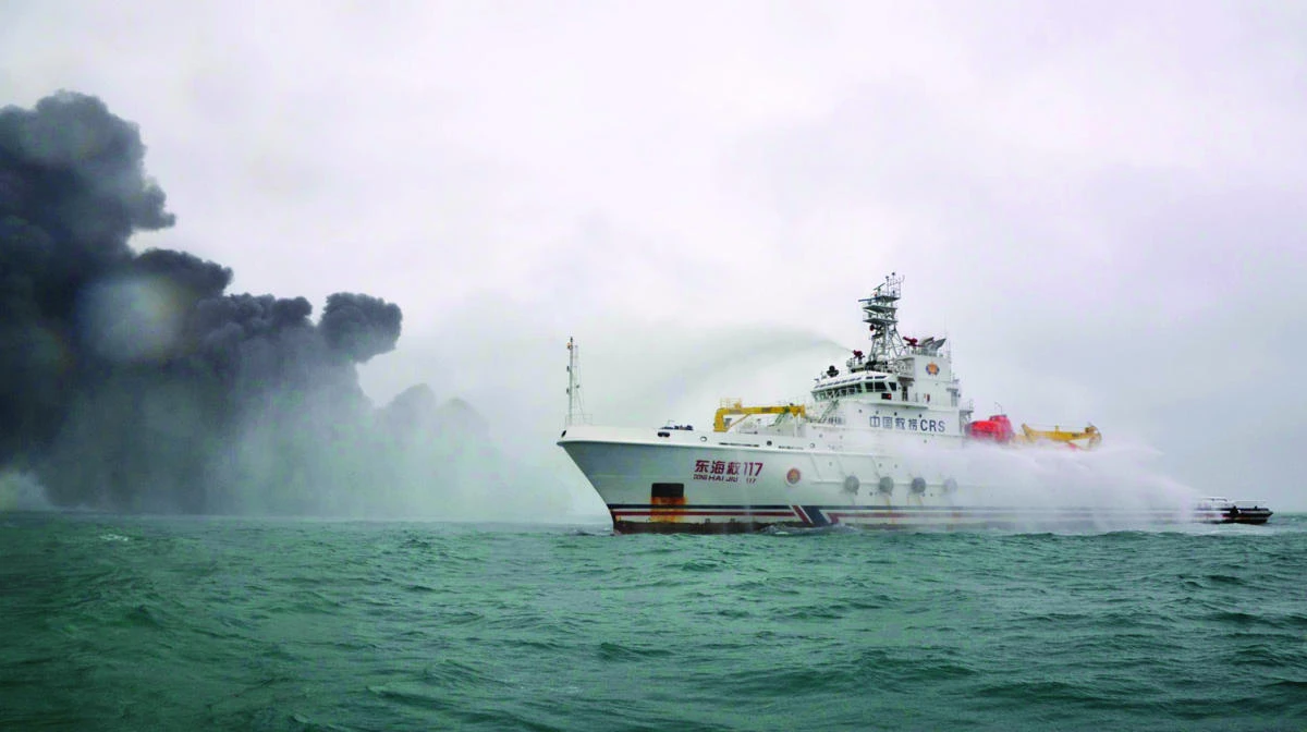 This handout from the Transport Ministry of China taken on Sunday and released on Monday shows the Chinese firefighting vessel "DONGHAIJIU 117" spraying water on the burning oil tanker Sanchi at sea off the coast of eastern China. (AFP)