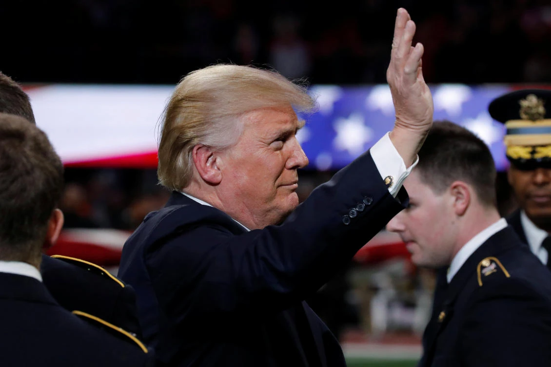 Trump gets boos and cheers in US south from football fans