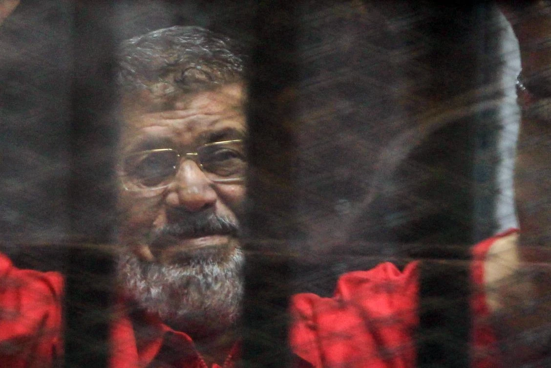 Ousted Egyptian President Mohamed Mursi looks on during a trial session on charges of espionage in Cairo. (EPA)