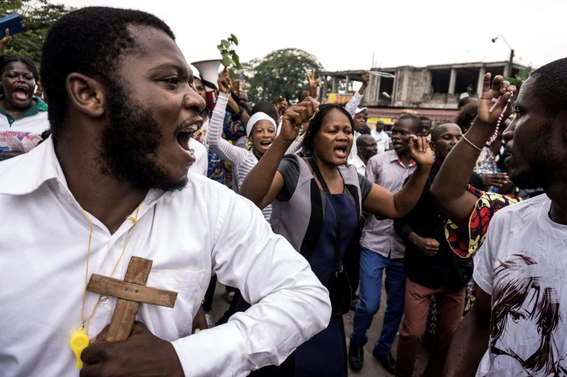 Congolese demonstrate to call for the President of the Democratic Republic of the Congo to step down, on December 31, 2017 in Kinshasa. The protesters are demanding that Kabila promise he will not seek to further extend his time in power in DR Congo, a mostly Catholic former Belgian colony. (AFP)