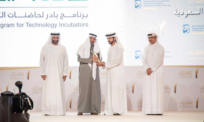 Nawaf Al-Sahhaf, CEO of Badir Program, second left, receives the award from Sheikh Hamdan bin Mohammed bin Rashid Al-Maktoum, the crown prince of Dubai, on Monday.