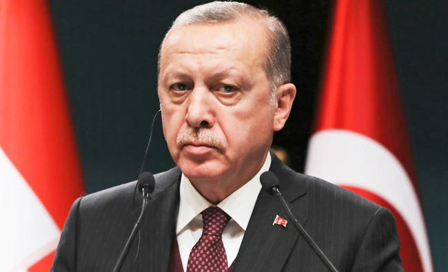 Turkey's President Recep Tayyip Erdogan, listens during a joint news statement with Croatia's President Kolinda Grabar-Kitarovic, following their meeting at the Presidential Palace in Ankara, Turkey, on Tuesday. (AP)
