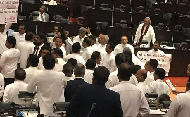 About 50 Sri Lankan lawmakers from both sides of the 225-member Parliament took part in the brawl, which erupted as Prime Minister Ranil Wickremesinghe was speaking over alleged corruption on the bond issue. (Courtesy Twitter: @HarshadeSilvaMP)