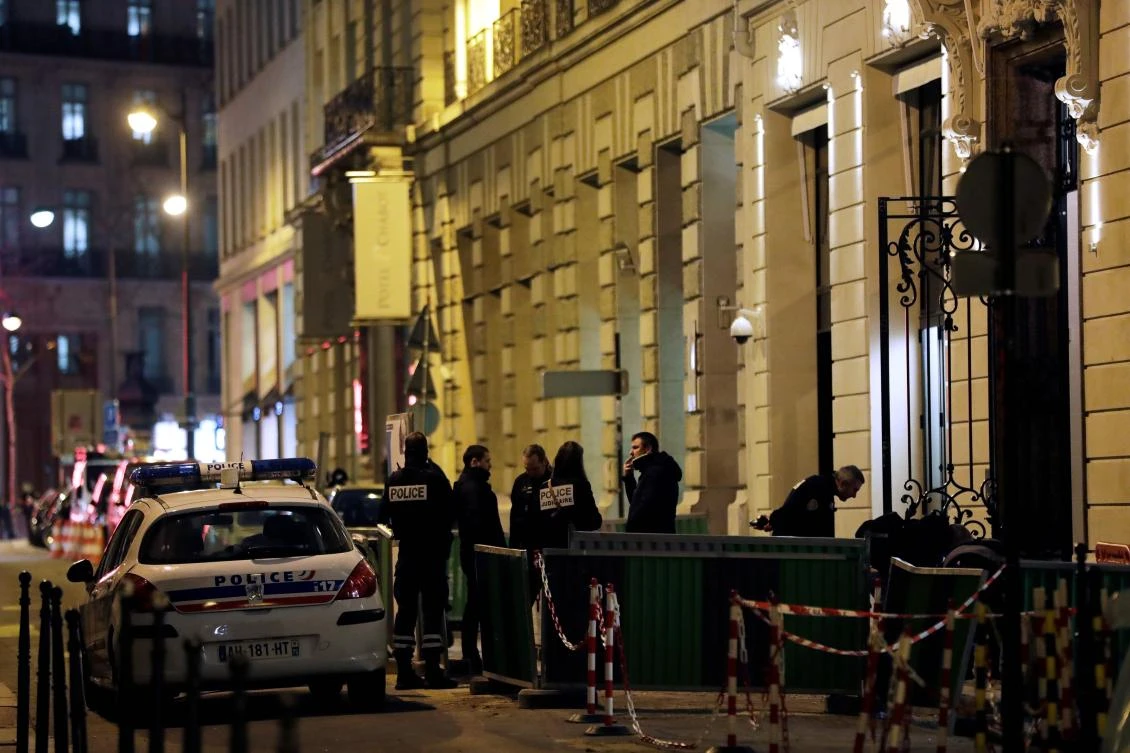Police stand at the back entrance of the Ritz luxury hotel in Paris on Jan. 10, 2018, after an armed robbery. (AFP)