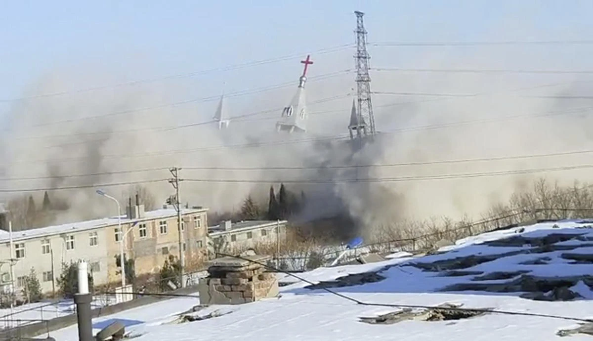 In this image taken from video shot Tuesday, Jan. 9, 2018, by China Aid and provided to the Associated Press, clouds of debris billow during the demolition of the Golden Lampstand Church in Linfen in northern China’s Shanxi province. Witnesses and overseas activists say paramilitary troops known as the People’s Armed Police used excavators and dynamite on Tuesday to destroy the Golden Lampstand Church, a Christian mega-church that clashed with the government. (China Aid via AP)