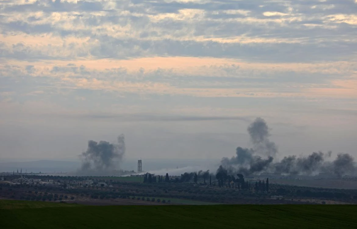 A general view shows smoke rising from the town of Al-Tamanah in Syria's Idlib province. (AFP)