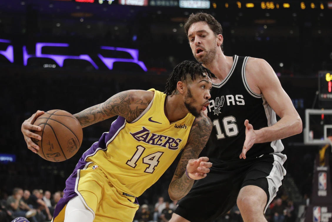 Los Angeles Lakers' Brandon Ingram, left, drives past San Antonio Spurs' Pau Gasol during the first half of their NBA basketball game on Thursday, January 11. (AP)