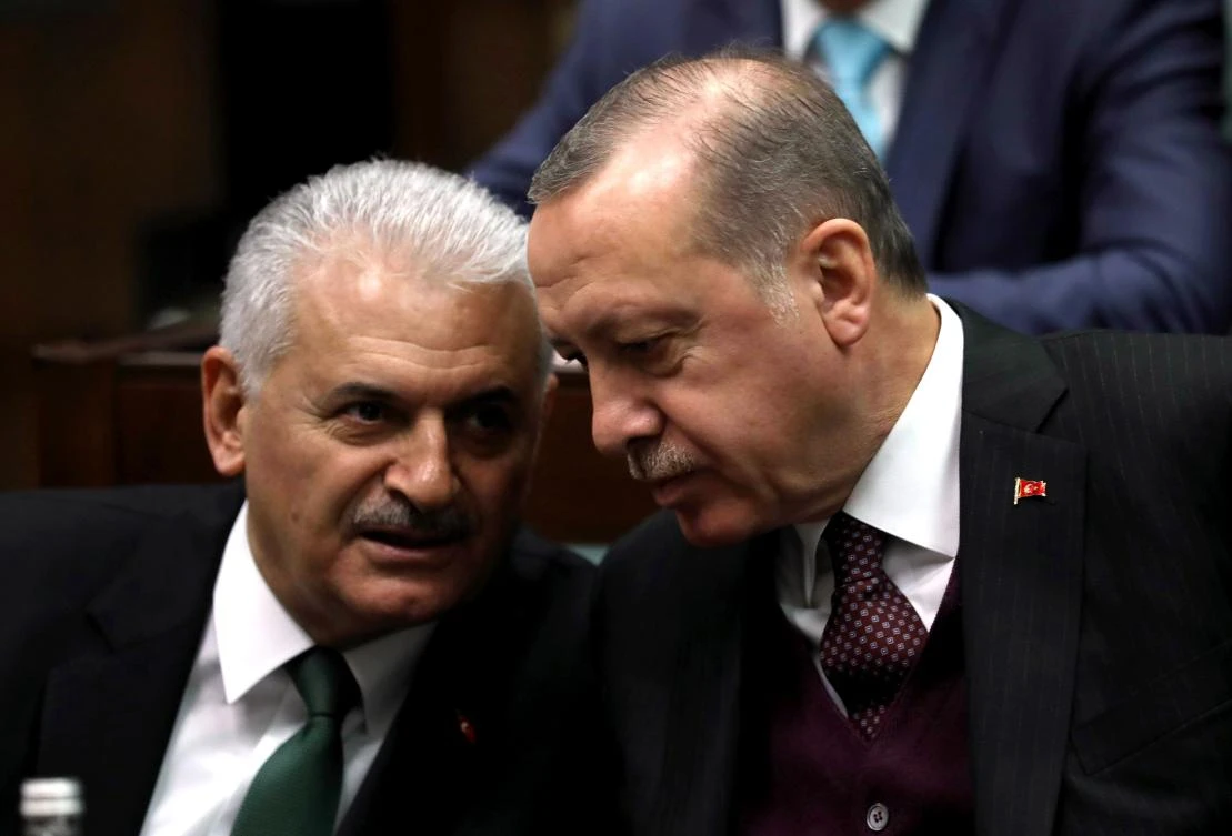 President of Turkey and Leader of the Justice and Development Party (AK Party) Recep Tayyip Erdogan (R) talks with Turkish Prime Minister Binali Yildirim in this file photo. Yildirim said the reciprocal travel warnings did not help the strained ties between Ankara and Washington. (AFP)