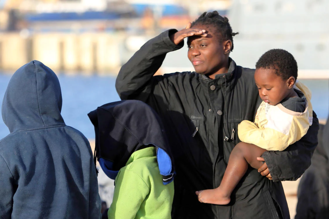 Illegal immigrants wait at a naval base in the Libyan capital Tripoli on Sunday after they were rescued off the coast of Garabulli, 60 km east of the capital. (AFP)