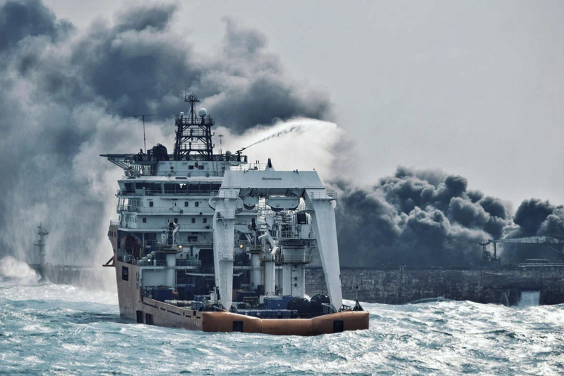 Chinese salvagers recover two bodies from flaming Iranian tanker