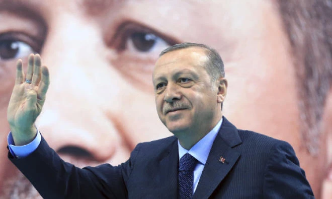 Turkey's President Recep Tayyip Erdogan waves to supporters of his ruling Justice and Development Party, at a rally in Elazig, eastern Turkey, on Saturday. (AP)