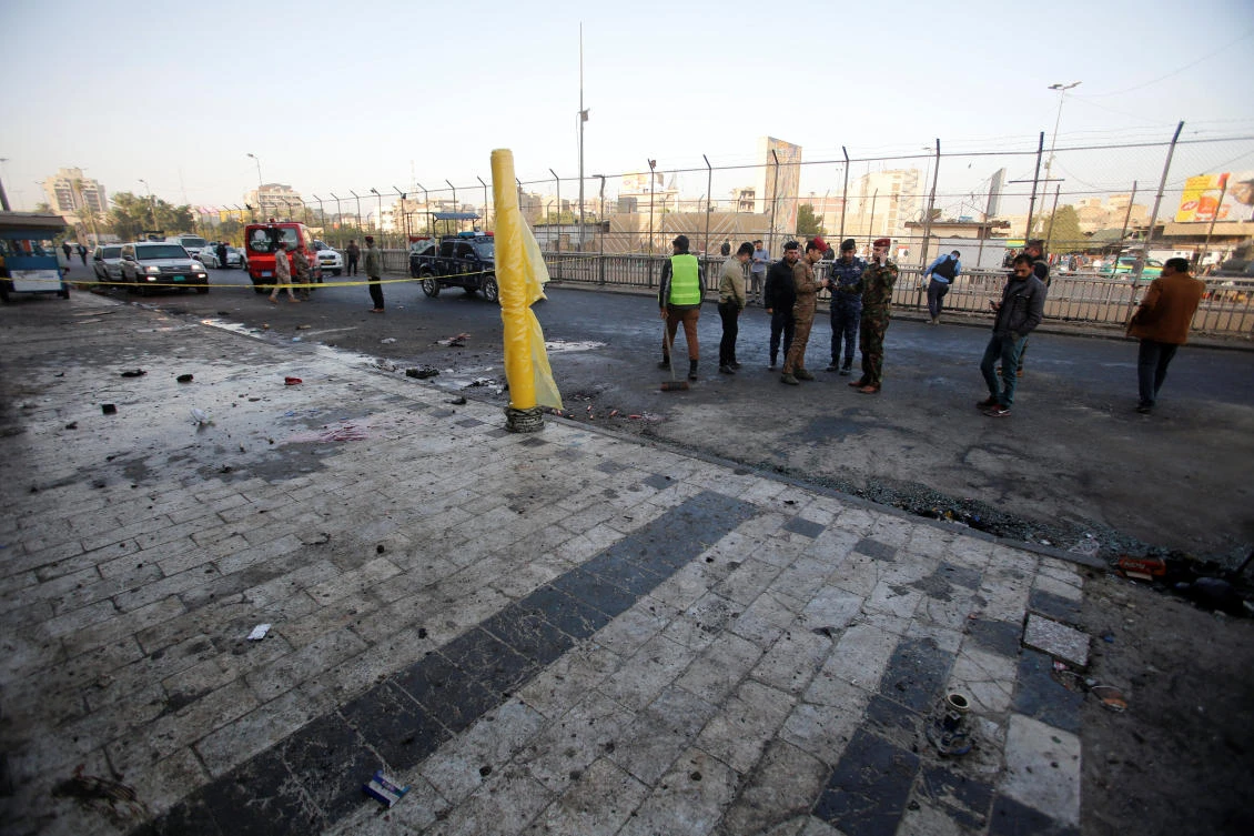 Iraqi security forces inspect the site of a bomb attack in Baghdad, Iraq January 15, 2018. (Reuters)