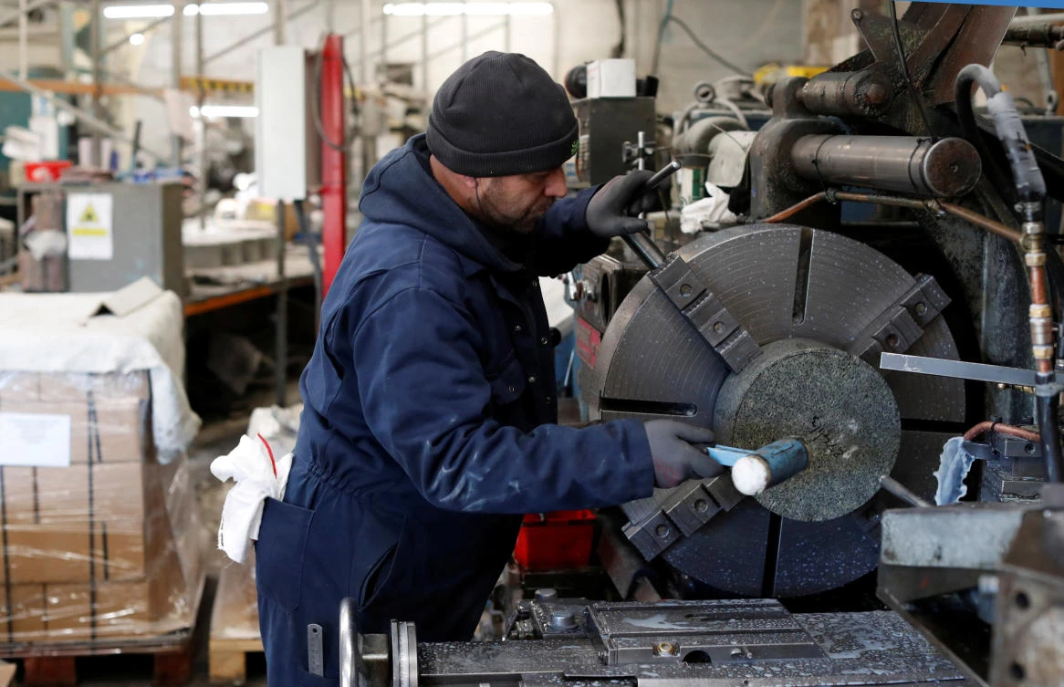 Above, a factory worker puts granite on the lathe to make a curling stone in Mauchline. Scotland’s economy represents less than a tenth of Britain’s economy as a whole. (Reuters)