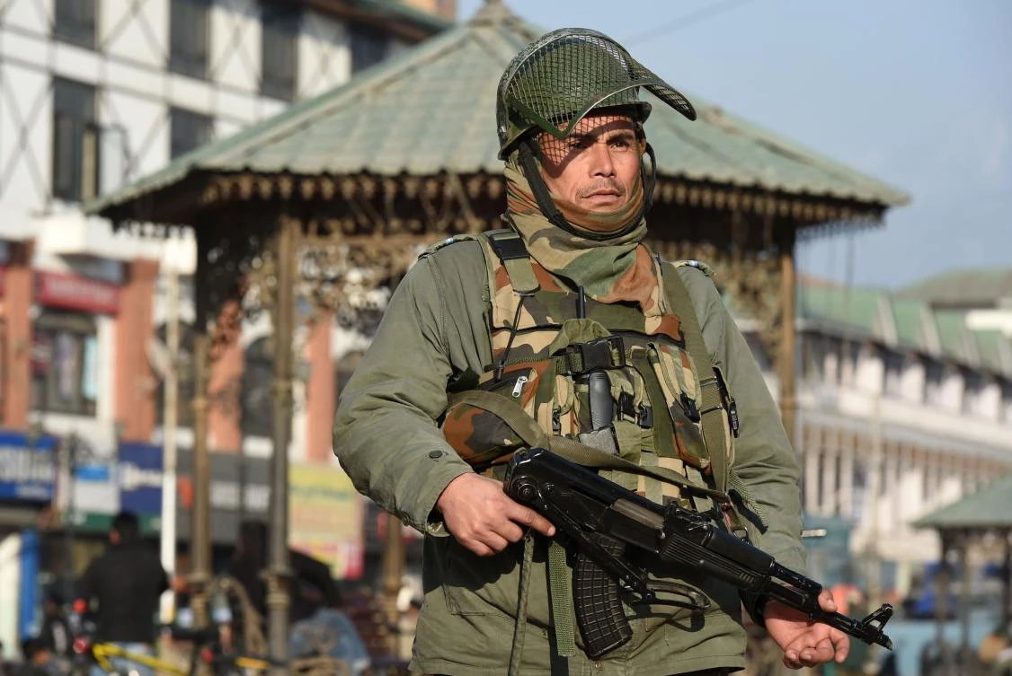 An Indian paramilitary trooper stands guard in Srinagar on January 15, 2018. (AFP)