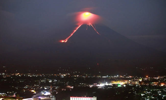Lava from Mayon volcano is seen as it erupts in Legazpi on Monday. (AFP)