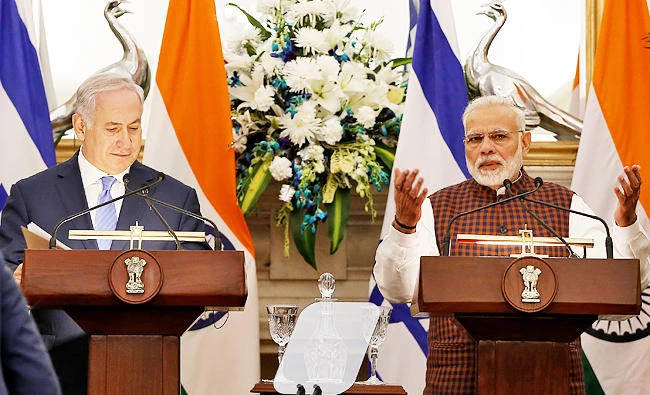 India's Prime Minister Narendra Modi speaks as his Israeli counterpart Benjamin Netanyahu looks on during a signing of agreements ceremony at Hyderabad House in New Delhi, India on Monday. (REUTERS)