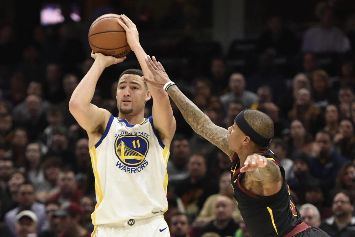 Golden State Warriors guard Klay Thompson (11) shoots a three point basket against Cleveland Cavaliers guard Isaiah Thomas (3) in the first quarter at Quicken Loans Arena. (David Richard-USA TODAY Sports)