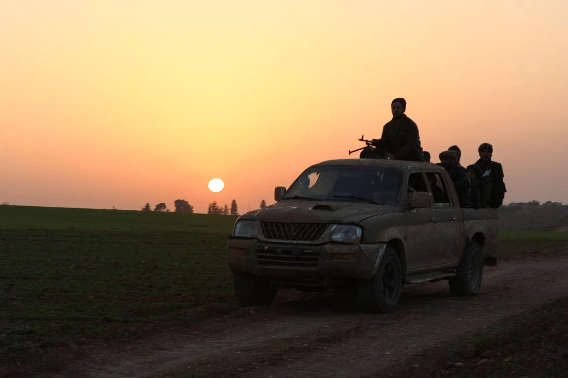 Opposition fighters head towards the frontline near the village of Al-Khuwayn during ongoing battles with government forces in Syria's Idlib province on January 13, 2018. (AFP)