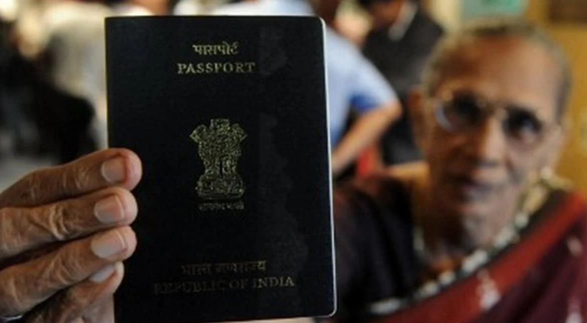 India plans to issue orange-covered passports to some migrant workers, not the regular blue passport, pictured above. (AFP)