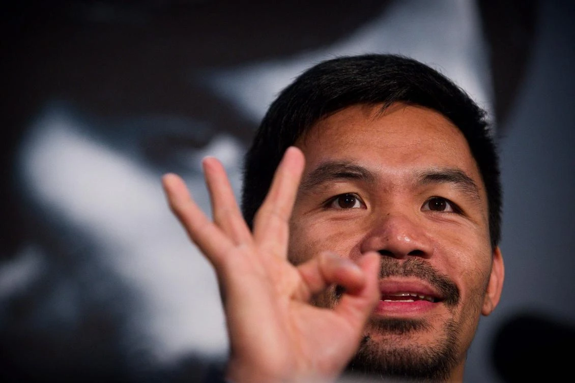 This file photo taken on April April 26, 2017 shows World Boxing Organization (WBO) welterweight defending champion Manny Pacquiao gesturing during a promotional press conference at Suncorp Stadium in Brisbane. (AFP)
