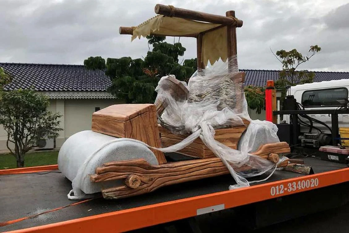 The belated birthday gift – a life-size replica of Fred Flintstone’s car from the classic cartoon – for Sultan Ibrahim Sultan Iskandar of Johor was given a modern-day upgrade of an engine so the sultan will not tire out his feet while taking a breezy ride on his latest wheels. (Royal Press Office via AFP)