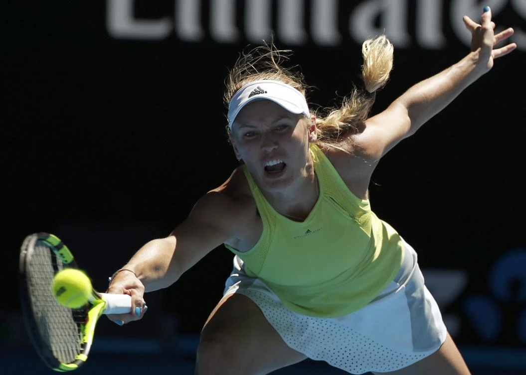 Caroline Wozniacki pulled off a remarkable escape in her match with Jana Fett where she won 3-6, 6-2, 7-5 after being 5-1 down in the third set. (AP)