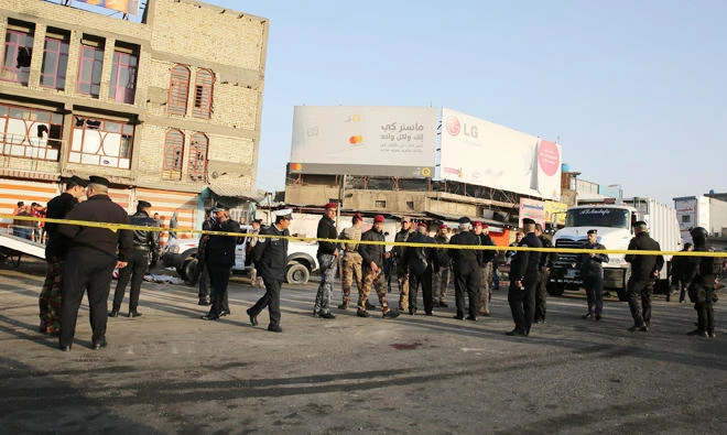 Iraqi security forces cordon off the area where a double suicide bombing killed more than 20 people in central Baghdad on Jan. 15, 2018. (AFP)