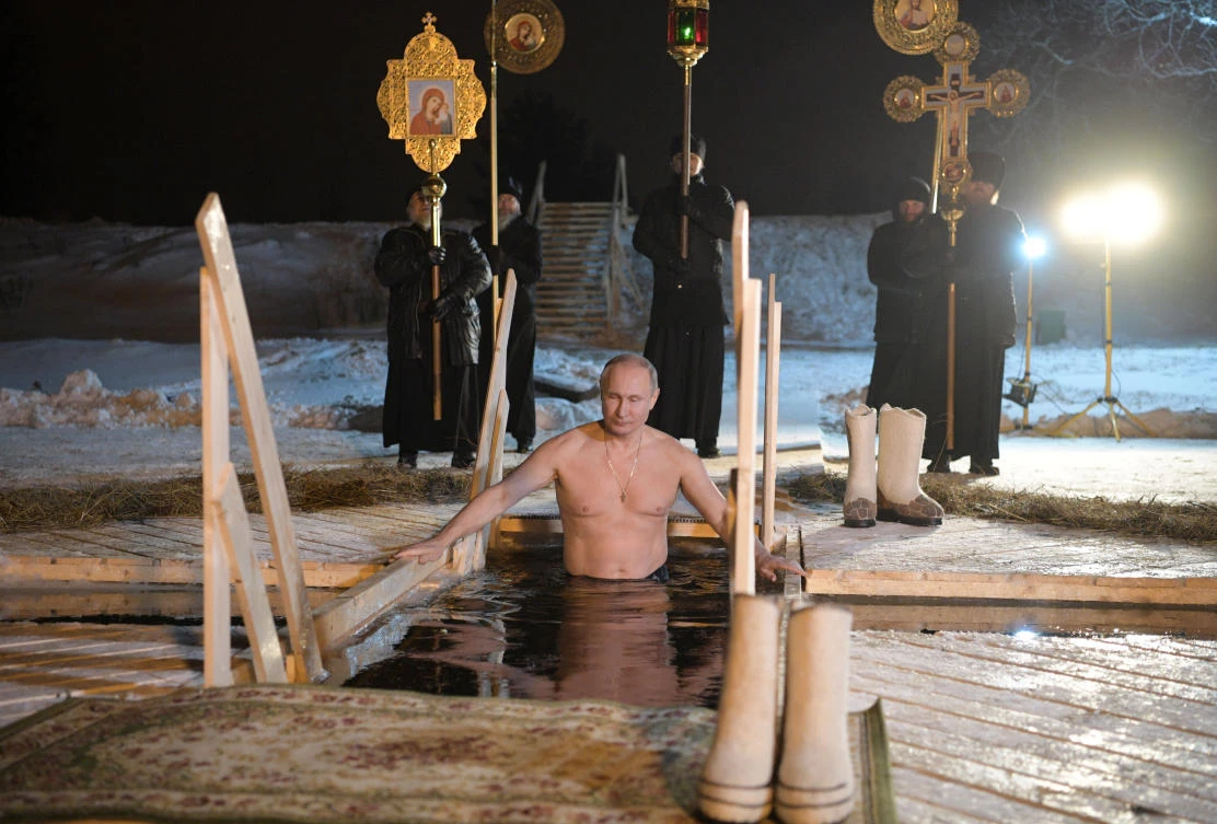 Russia’s Putin takes Epiphany’s icy plunge with Orthodox pilgrims
